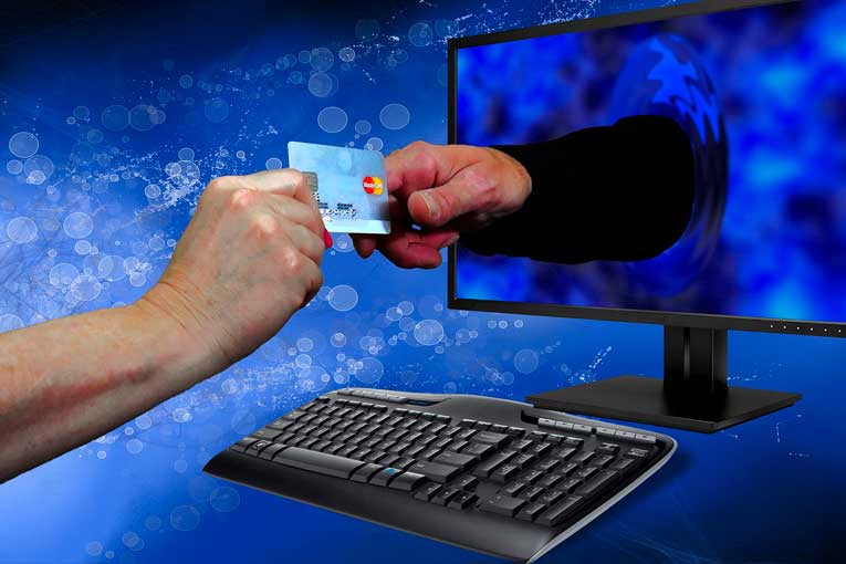 Hacker Holding Credit Card