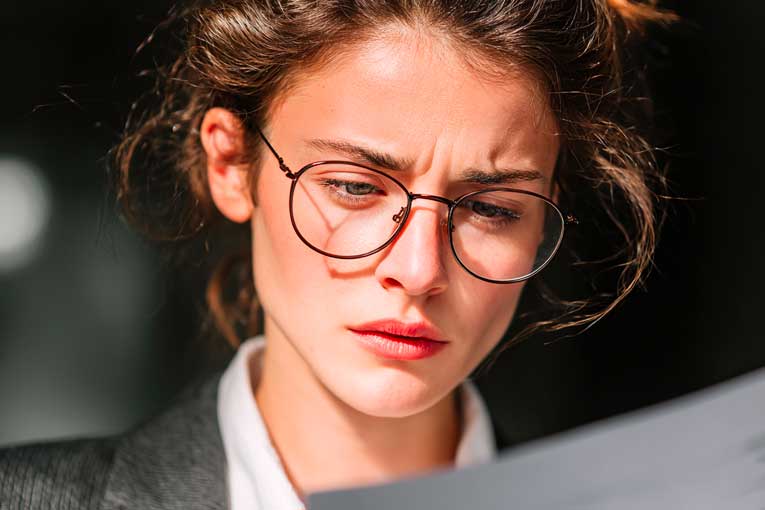 1-ISJ- What is Suspicious Activity Reporting (SAR)? Bank Employee Inspecting Suspicous Transactions