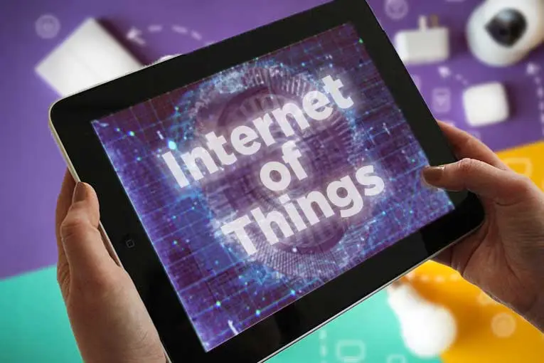 image showing someone controlling iot devices with a touchscreen